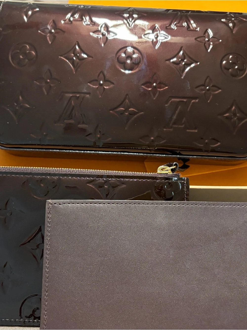 Louis Vuitton Burgundy Patent Leather Interior with Gold Chain Accent